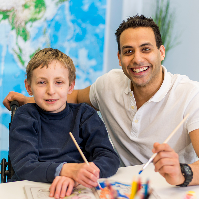 Teacher with student in wheelchair